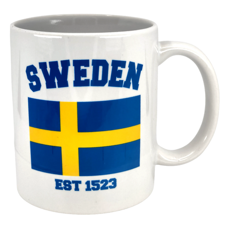The Swedish Gift Store’s Established Series Sweden Flag Mug (11 oz) displays “SWEDEN” in blue, a yellow and blue flag, and “EST 1523”—a stylish tribute to Sweden’s heritage.