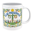 The 11 oz "Glad Midsommar" mug from Swedish Gift Store features colorful florals, dancers in traditional dress around a maypole, and a cheerful sun with “Glad Midsommar” text—perfect for celebrating Swedish summer.
