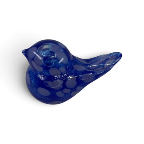 Small, smooth dark blue hand blown glass bird figurine with lighter blue spots, displayed on a white background.