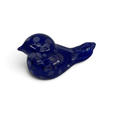 Small, dark blue hand blown glass bird figurine with a smooth, glossy surface and subtle speckled pattern, shown on a white background.