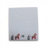 The Swallings Dala Horse Note Pad (3.76"w x 4"h) features blue lines on a white background, with two red Swedish Dala horses and vibrant floral designs at the bottom. Made in Sweden.