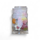 Three single serving 1.6 oz Sockerbit Swedish candy bags are arranged in a row on a white background, offering delightful GMO-free treats perfect for snacking.