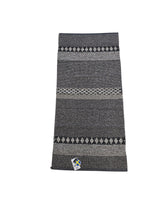 The Horredsmattan - Forest - Graphite is a rectangular cotton/vinyl rug with gray and black geometric patterns and a small tag by one edge, shown on a white background.