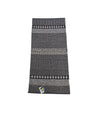 The Horredsmattan - Forest - Graphite is a rectangular cotton/vinyl rug with gray and black geometric patterns and a small tag by one edge, shown on a white background.