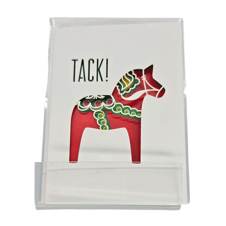 Card: Tack! Swedish Thank You Card – Laser-Cut Dala Horse Design features "TACK!" above a red laser-cut Dala horse on white card stock, displayed upright in a clear stand—a charming way to say thank you.
