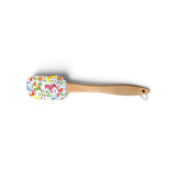 Silicone spatula with a wooden handle and a white head featuring a colorful Swedish Dala horse and floral pattern.