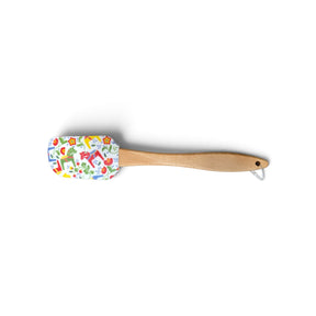 Silicone spatula with a wooden handle and a white head featuring a colorful Swedish Dala horse and floral pattern.