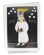 The Card: Lucia Greeting Card by Lisa Rydin Erickson features a girl in a white dress with a candle crown, holding pastries on a Fika tray, set among glowing houses—a charming Scandinavian holiday card. Blank inside with envelope included.