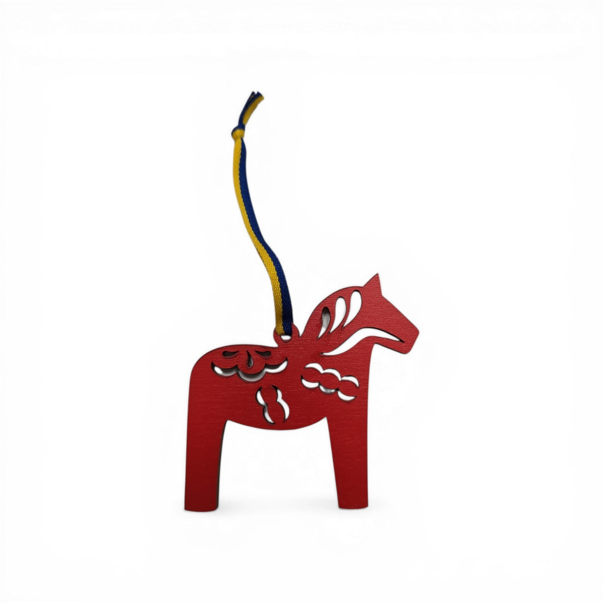 A red laser-cut Dala Horse ornament with Kurbits design, featuring a blue and yellow ribbon, handcrafted in Sweden, shown on a plain white background.