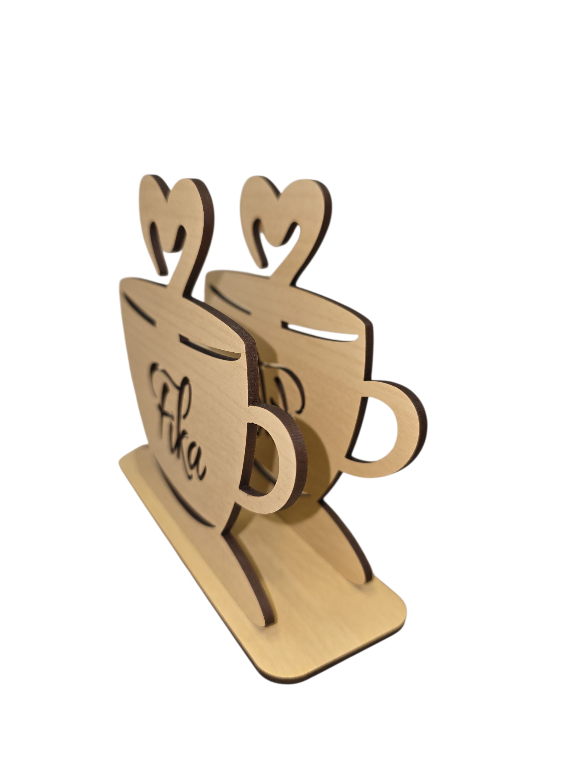The Napkin Holder - FIKA Coffee Cup is a laser-cut birch napkin or letter holder (6"x5"x1.75") shaped like two coffee cups with heart handles and "FIKA" engraved on the front—an ideal piece of charming FIKA decor.