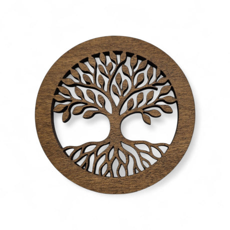 A 4" round wooden coaster with a laser-cut Tree of Life design and cork back, blending elegance and Scandinavian-inspired craftsmanship.