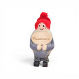 The Swallings Swedish Santa with "Valkommen" welcome sign is a 6.5" handcrafted figurine from Sweden. This Nordic décor features a white beard, red knit cap, glasses, grey sweater, and black feet—perfect for festive displays.