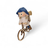 Figurine: Tomte Girl on Bike with Backpack 4.5" Tall with Hanging String Handcrafted in Scandinavia