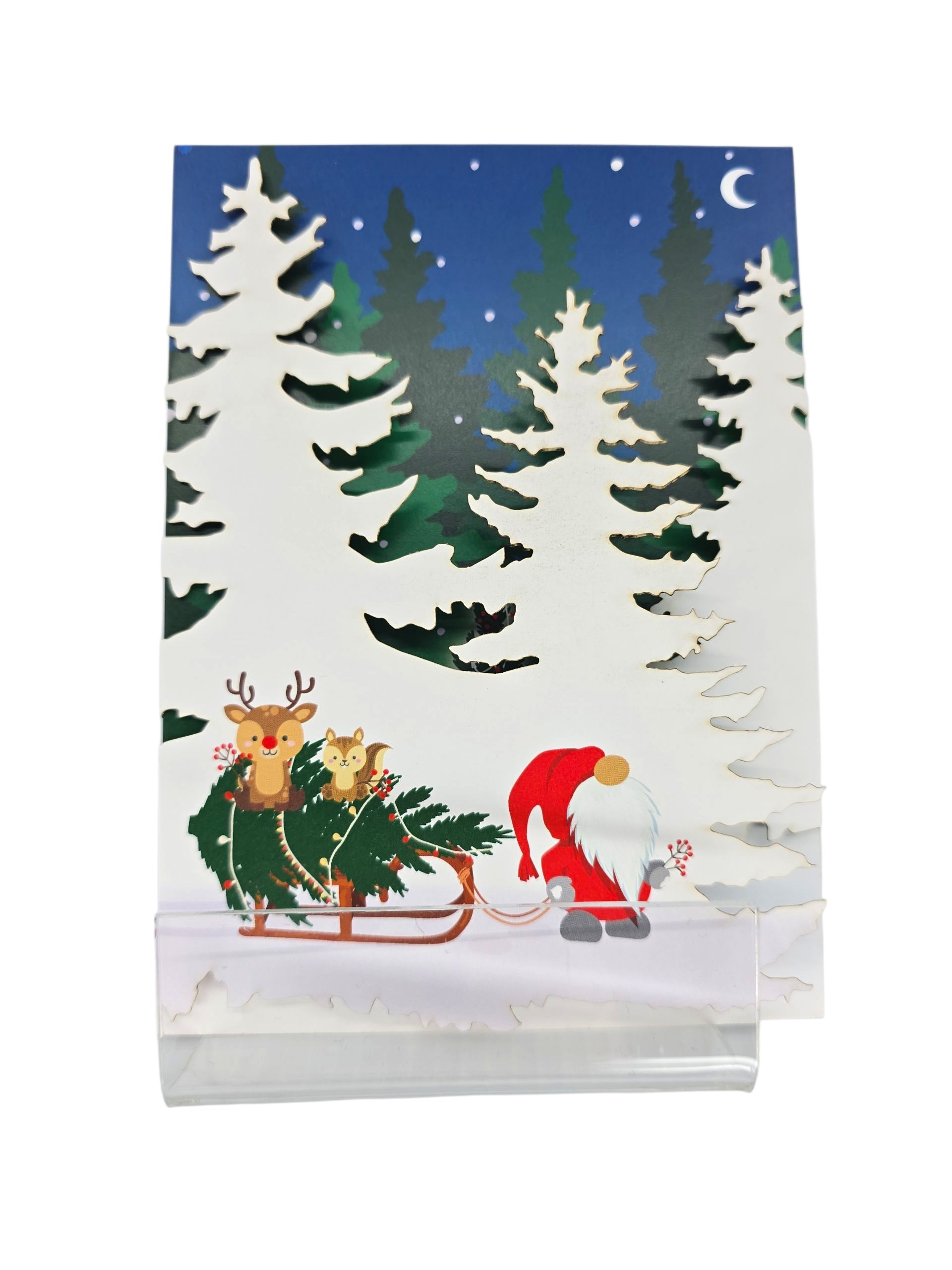 A festive Scandinavian card, "Cards: Nisse Pulling Sled with Text 'Happy New Year!'", shows a gnome pulling a sled with a Christmas tree and two reindeer in a snowy forest under a starry night sky and crescent moon.
