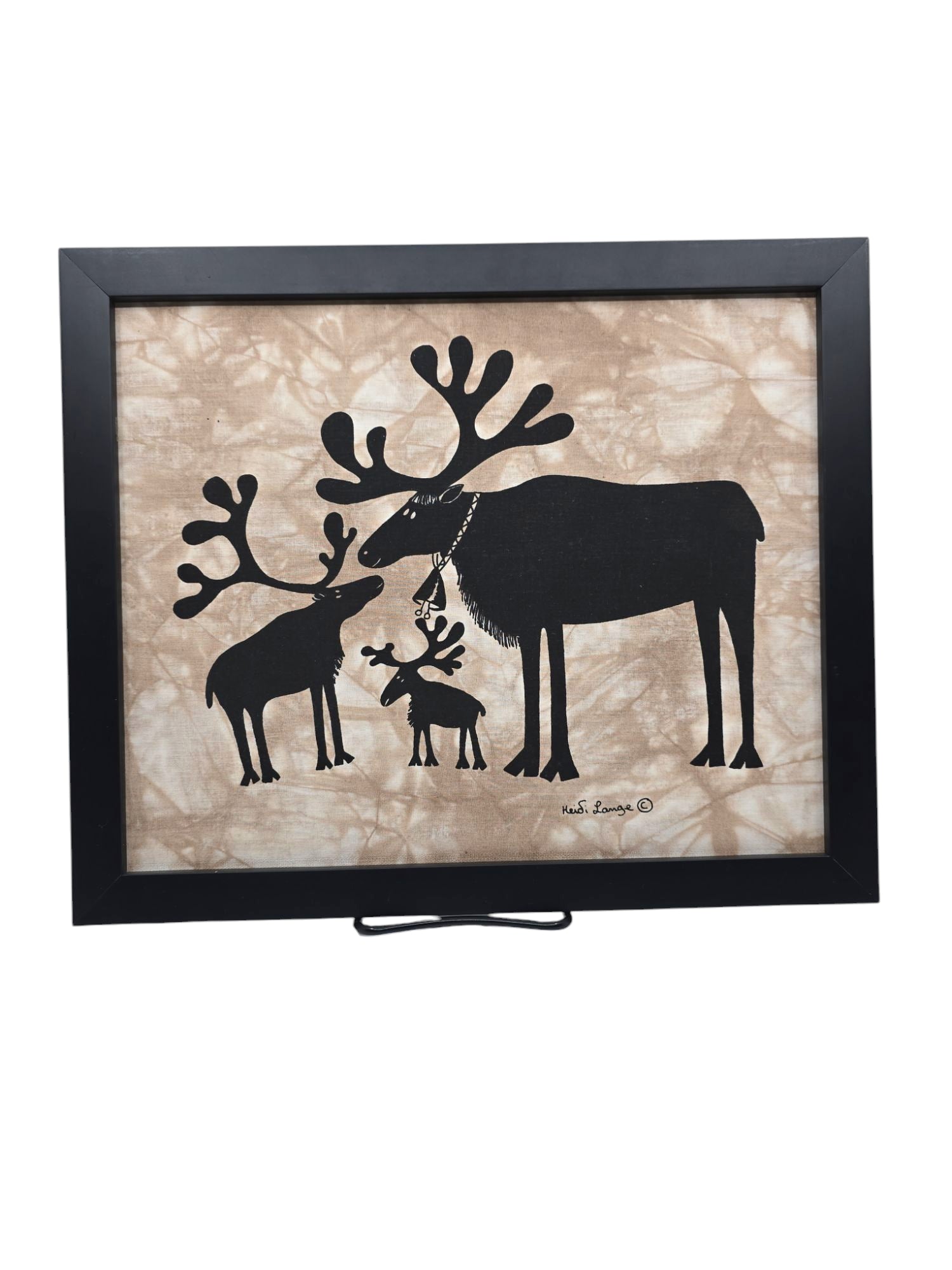 The Reindeer Family artwork (14x11 framed) showcases a silhouette of a large reindeer and two smaller ones on a textured beige background.