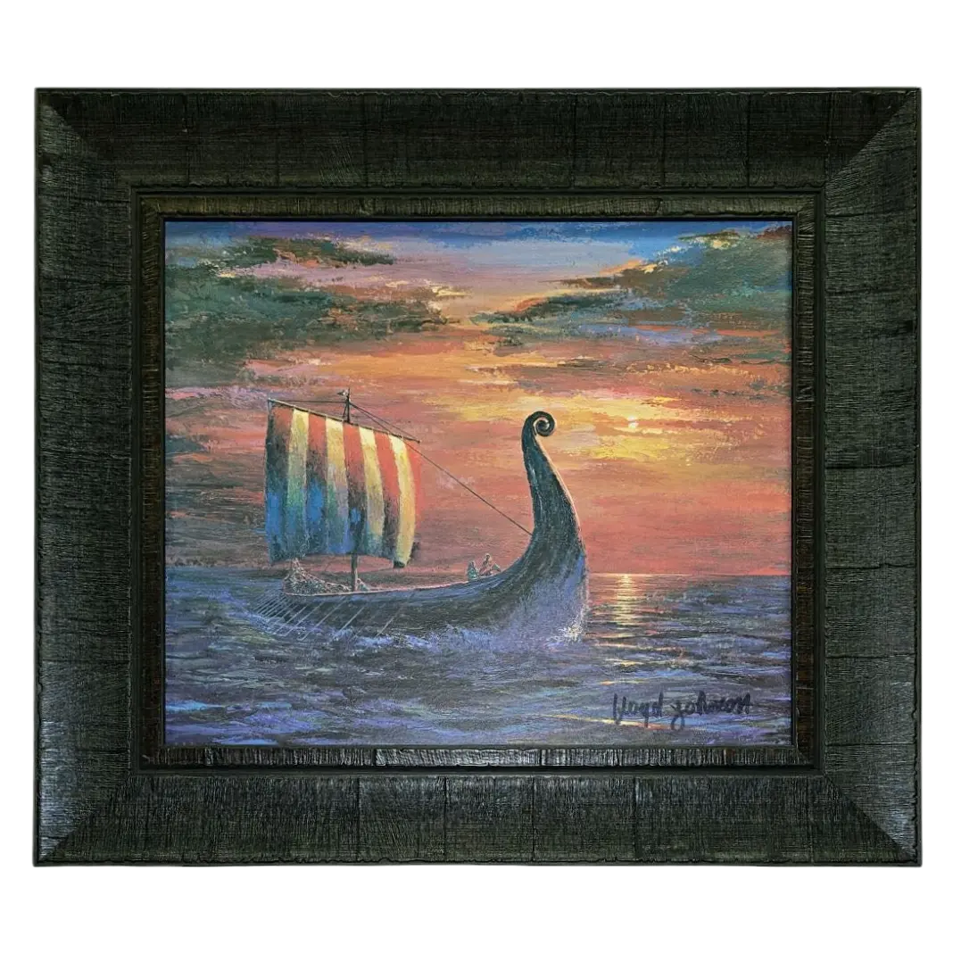 Final Light At Sea by Floyd Johnson (Faire - Scandinavian Specialties): Framed acrylic artwork of a Viking ship with striped sail at sunset, dramatic clouds, and vibrant colors reflected on the ocean in a dark brown frame.