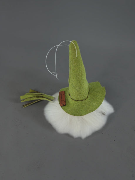 Green felt gnome ornament with a white beard and a hanging string.