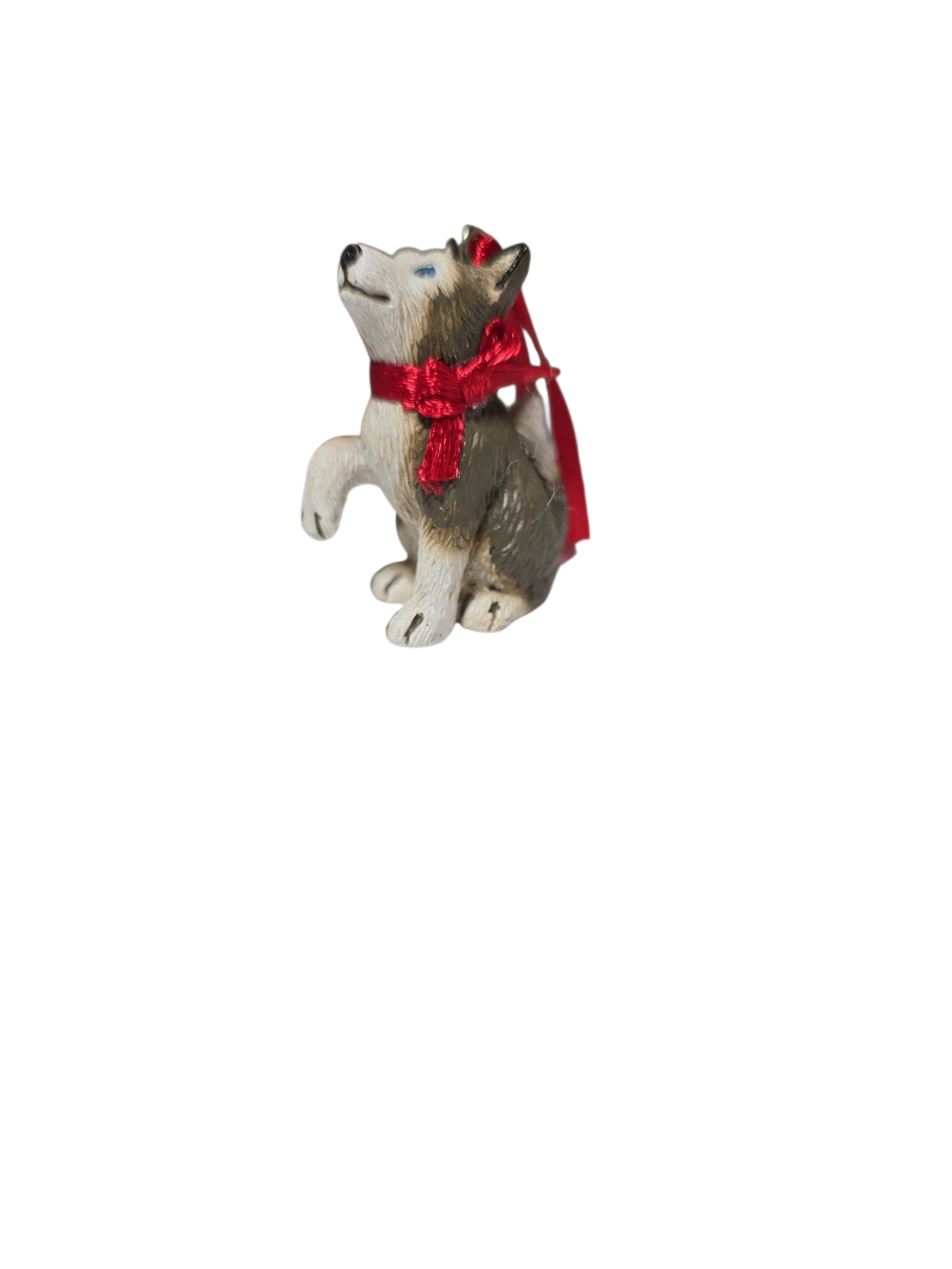 Birki – Anja’s Husky Puppy from The Wish Books, a 1.75" tall ornament featuring a sitting husky puppy with a red ribbon, perfect for Christmas tree decoration, shown on a white background.