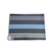 Rectangular woven vinyl rug with horizontal gray, black, and light blue stripes and a small Swedish flag tag.