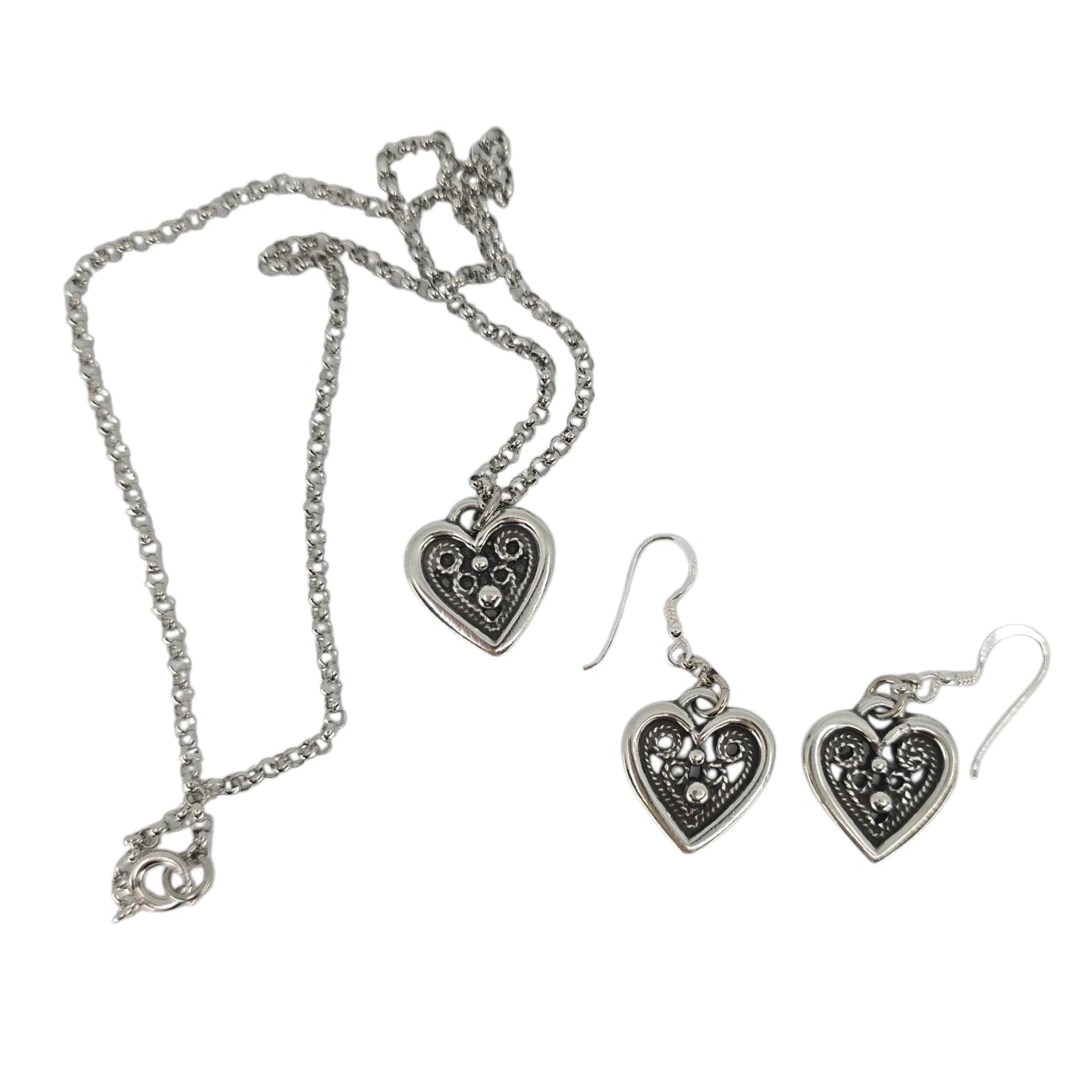Hillestad of Norway’s heart-shaped pewter earrings feature sterling silver hooks and a delicate dotted design, capturing the timeless elegance of Scandinavian jewelry.