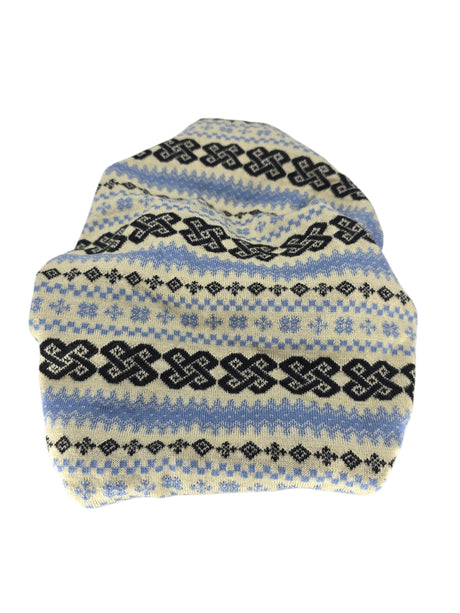 The Neck Warmer features a knitted Norwegian wool fabric with geometric patterns in blue, black, and off-white, shown flat on a white background. Ideal as multifunctional headwear or a cozy neckwarmer.