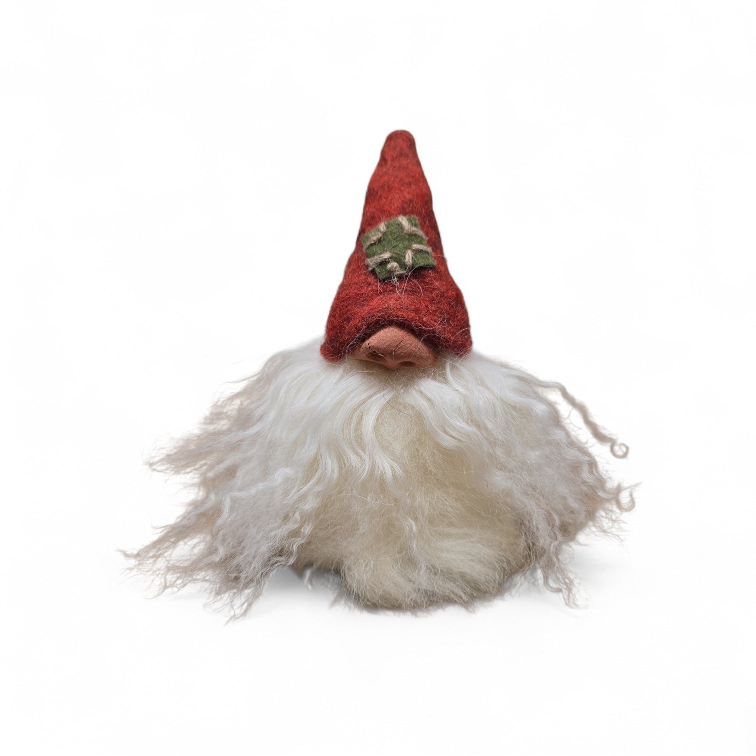 The "Patch Tomte" Gnome by Gumselids of Sweden is a 7" handcrafted figurine with a long white beard and tall red hat featuring a green star, displayed on a wood base against a plain white background.