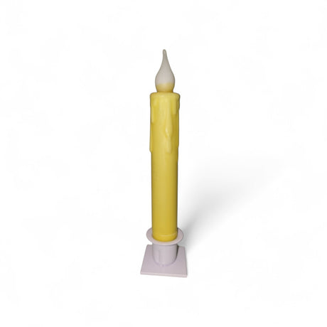 A Candle: Hand-Dipped Beeswax 7" Tapered LED Light sits upright in a white holder against a plain white background. This battery-operated timer candle mimics melted wax details for a realistic look.