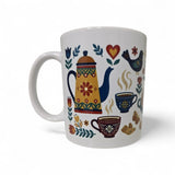 The "Mug: Fika — En Svensk Tradition Kaffepaus" from Swedish Gift Store is an 11oz white ceramic coffee mug with a colorful folk-art design of a teapot, steaming cups, flowers, bird, hearts, and cookies—perfect for a Swedish fika.