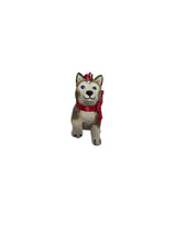 Charming 1.75" Ornament: Birki - Anja's Husky Puppy from The Wish Books, featuring a small dog figurine with a red scarf standing upright on a white background for festive flair.