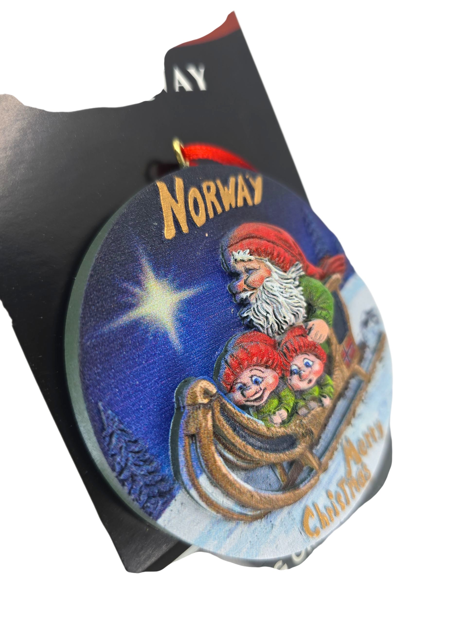 Celebrate Christmas with the “Norway” Santa with Elves on Sleigh 3D painted resin ornament (3" diameter)—a festive Scandinavian decoration featuring a Norwegian Santa and elves, perfect for your holiday tree!.