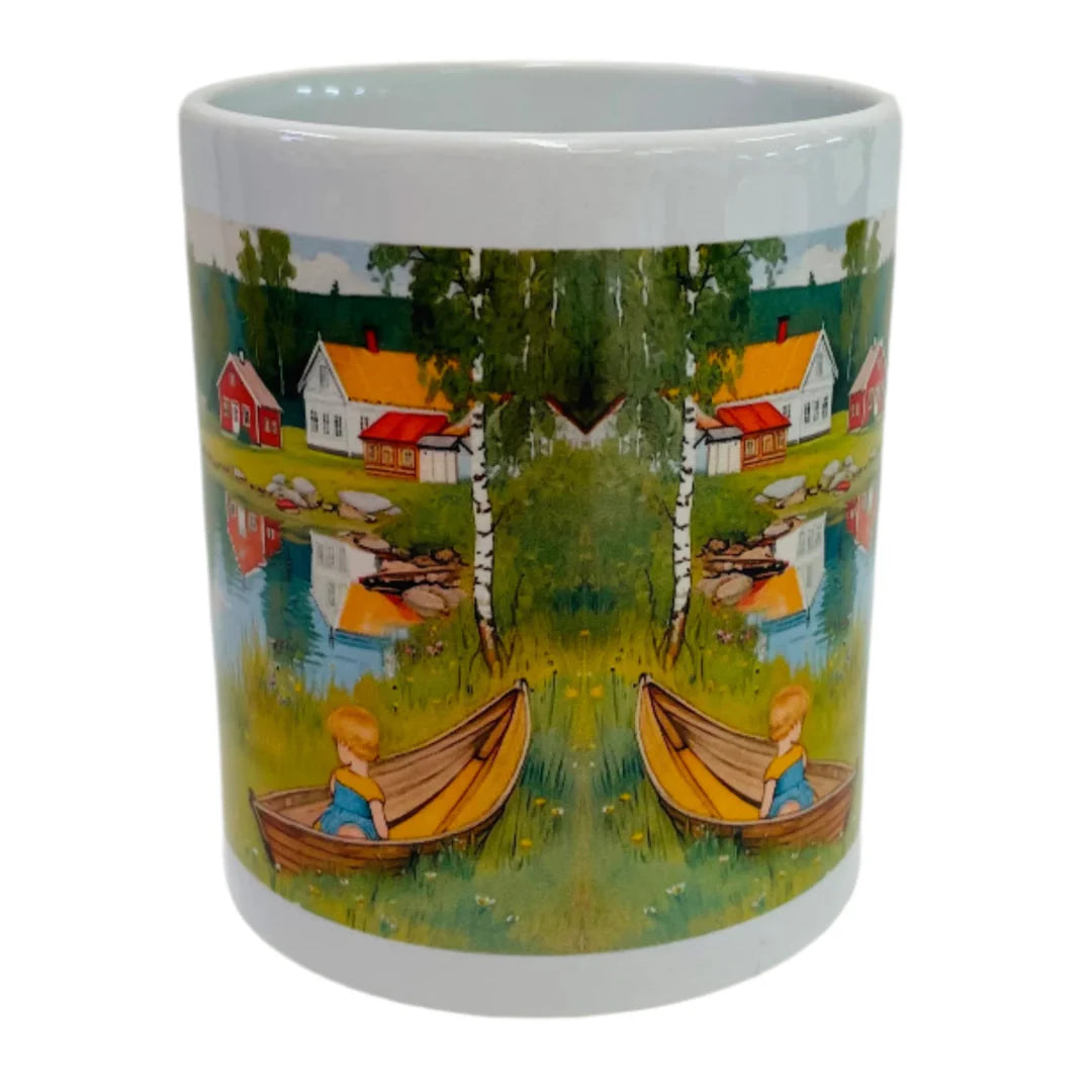 The Coffee Mug: Children by the Lake in Summer Coffee Mug features a white Scandinavian design with a child in a wooden boat, surrounded by water, houses, trees, and a Carl Larsson-inspired mirrored landscape.