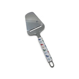 Stainless steel cheese slicer with a white handle featuring a pattern of colorful Swedish Dala horses.