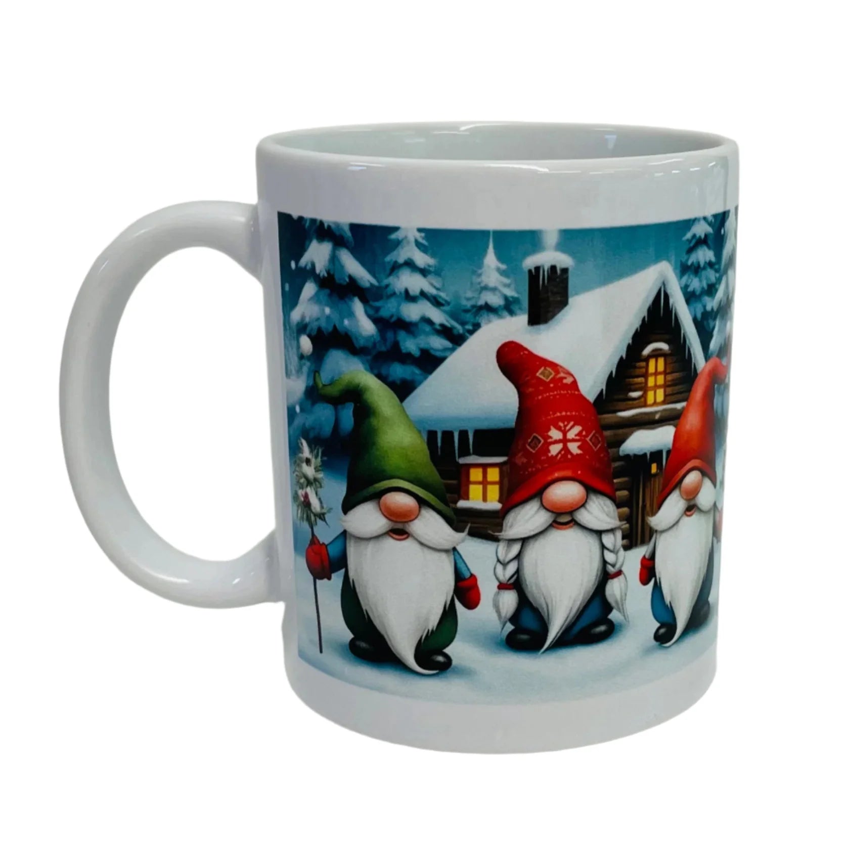 The Mug: Three Gnomes coffee mug displays three gnomes with tall hats standing before a snowy cabin surrounded by pine trees.