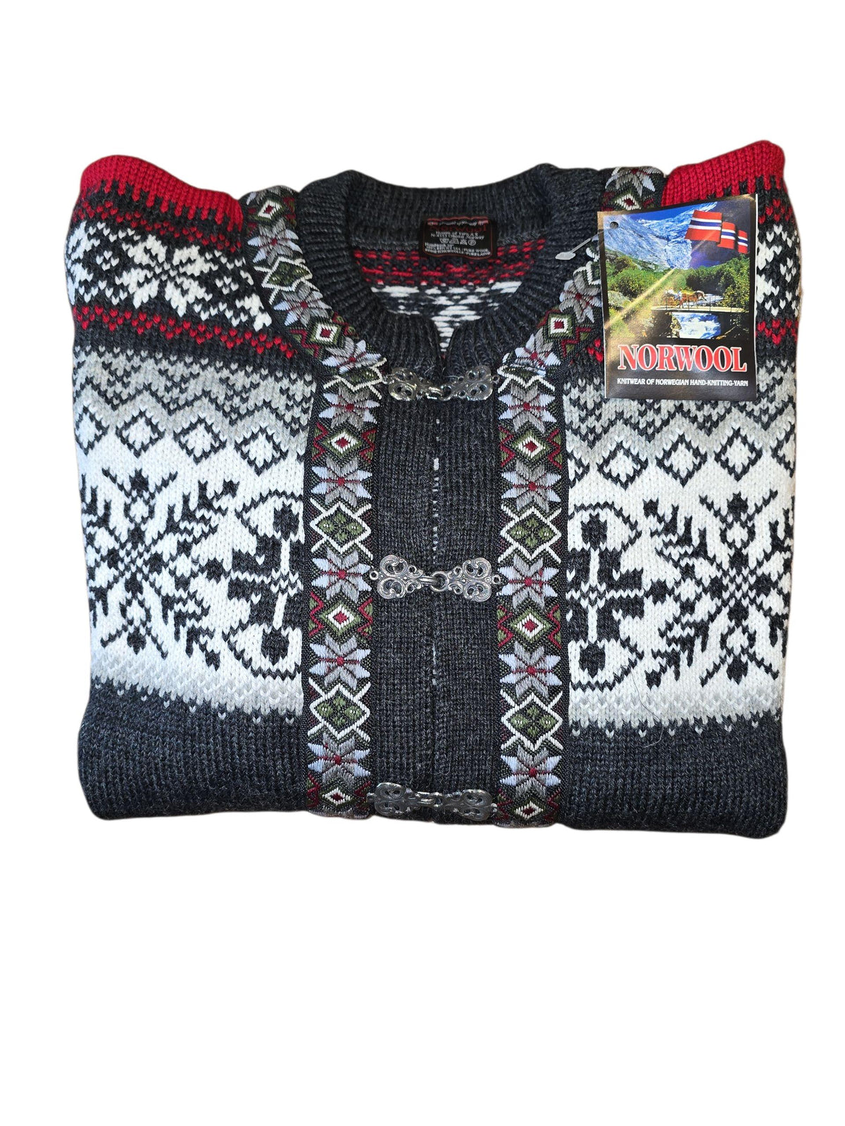 Folded Norwool Classic Norwegian Cardigan in dark gray with Selbu Star design and metal clasps; crafted from 100% pure wool with product tag attached.