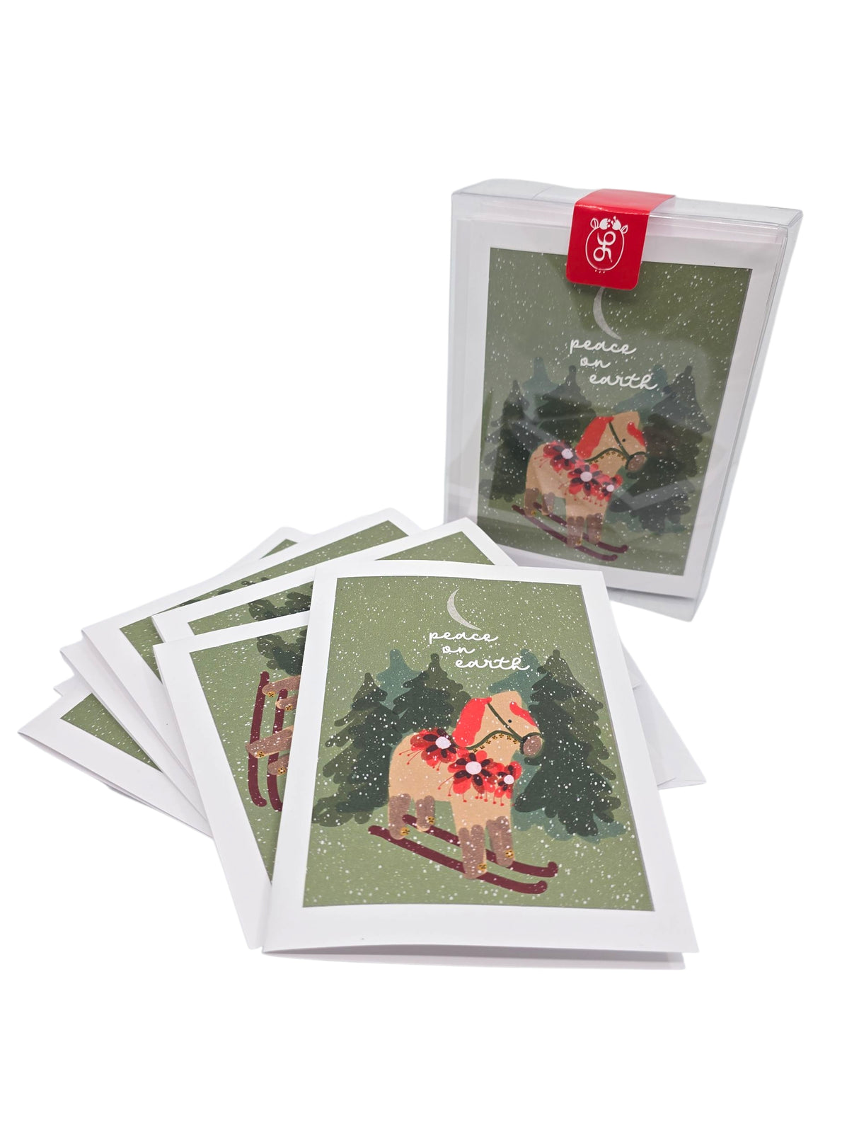 Card Pack: Dala Horse on Skiis “Peace on Earth” by Lisa Rydin Erickson—set of 8 blank Scandinavian holiday cards with envelopes, featuring a snowy scene with a decorated Dala horse and trees.