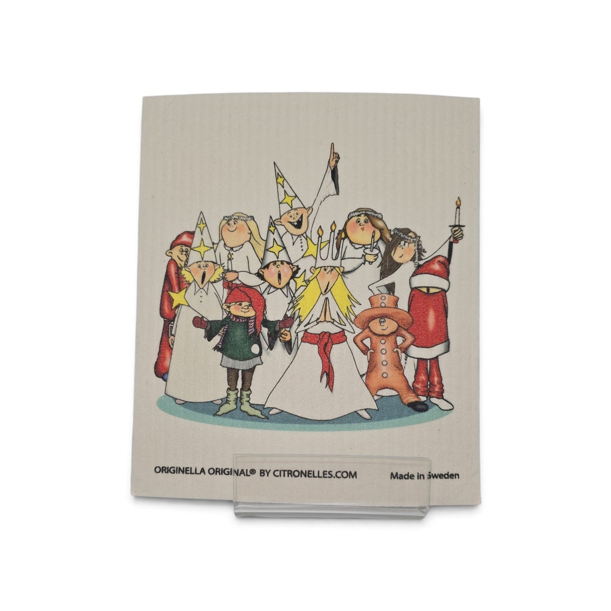 Swedish dishcloth featuring cartoon children in festive costumes, including Santa, gnomes, and girls with candles celebrating a Swedish Christmas.