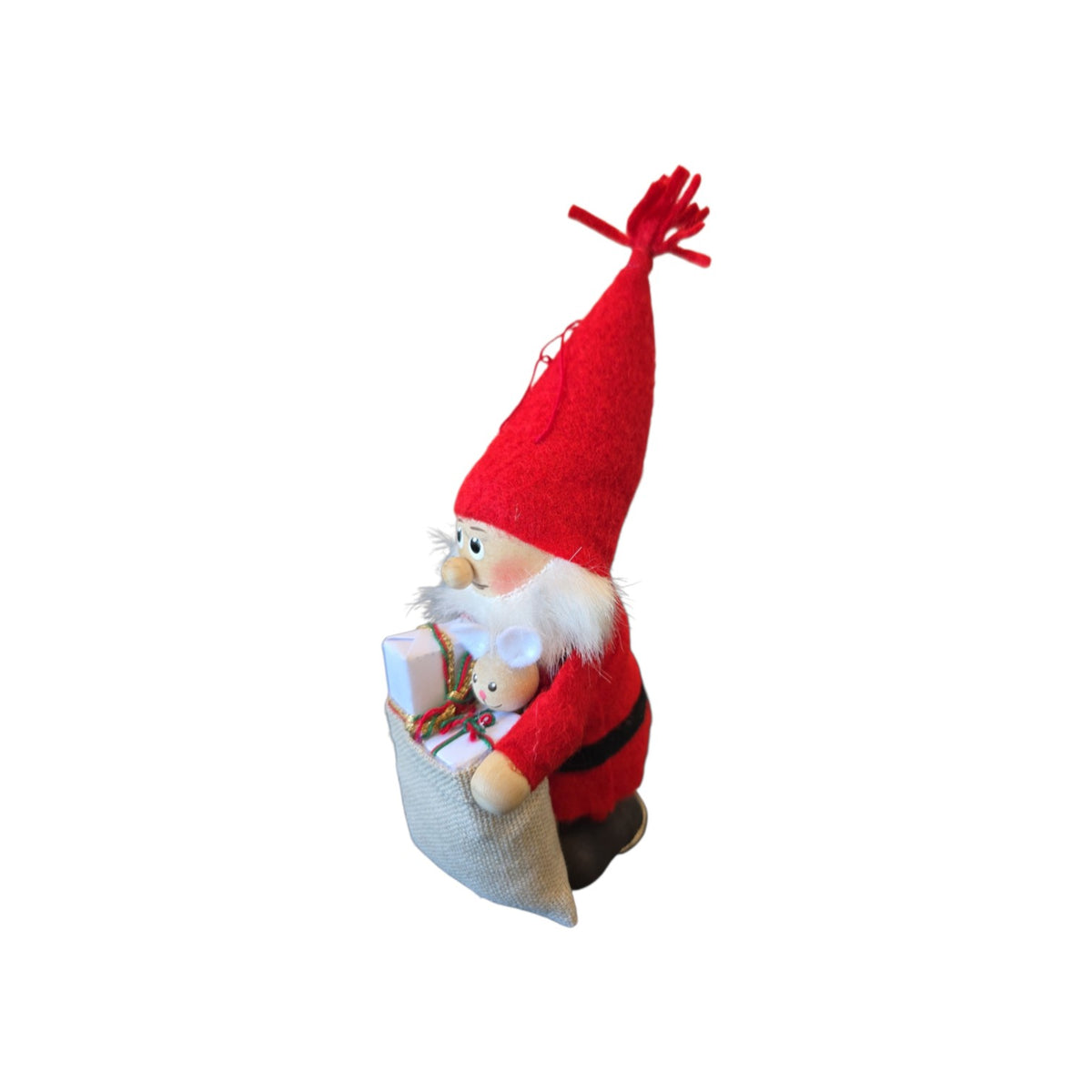 Scandinavian Santa figurine with a tall red hat, white beard, and a burlap sack filled with Nordic gifts and a white mouse.