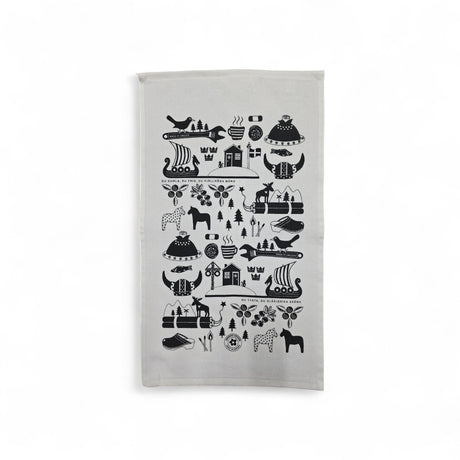 The "Made in Sweden" white & black terry hand towel (12"x21") features Scandinavian folk art designs—animals, trees, crowns, ships, and geometric patterns—arranged in horizontal rows on soft cotton.