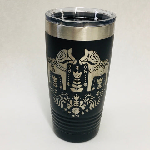 Dala Horses on Black Tumbler features a Nordic horse design and floral patterns, paired with a clear lid. This Polar Camel travel tumbler is designed with double-wall vacuum insulation to maintain your drinks at the ideal temperature.