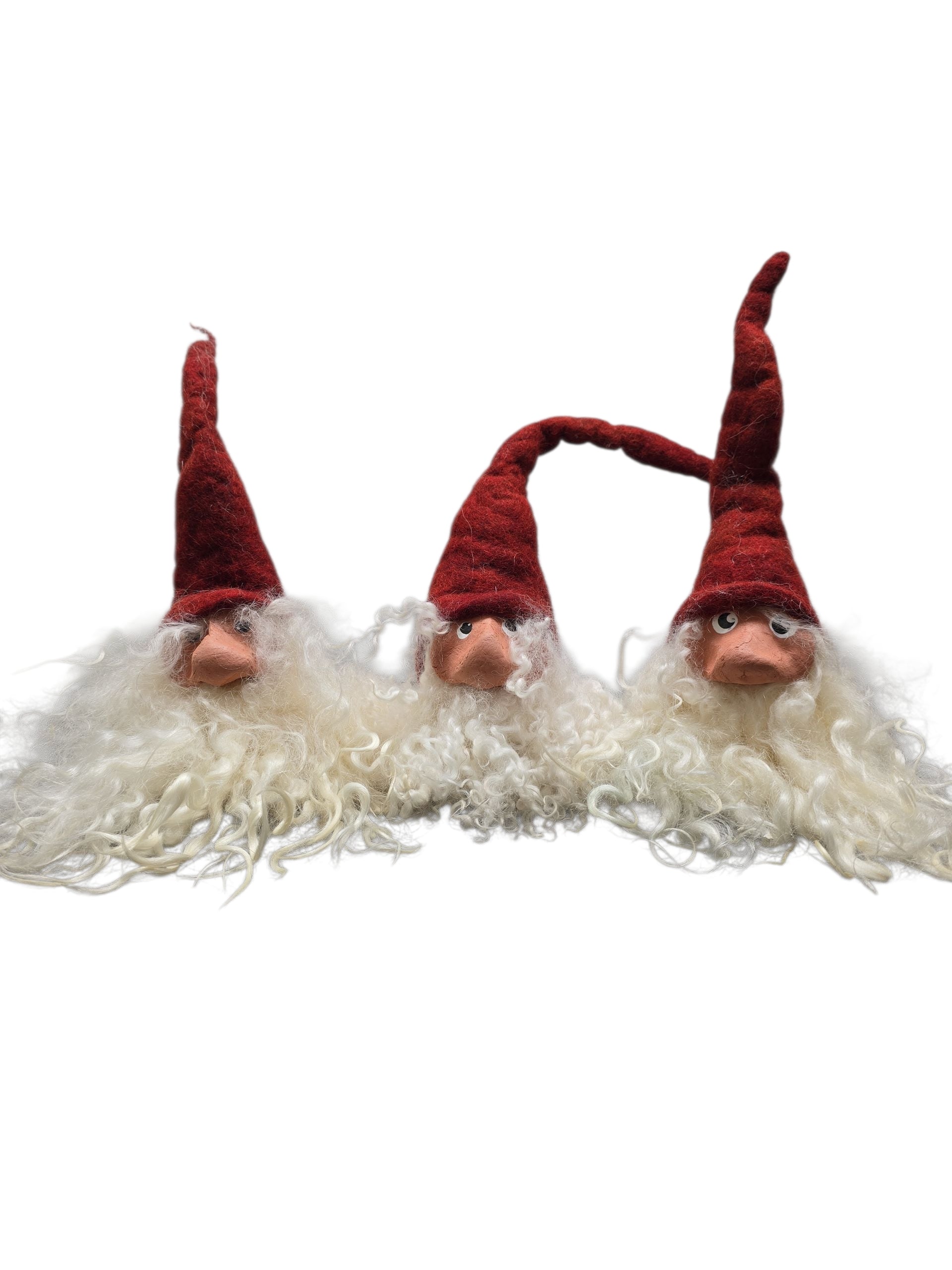 Three Gnome: Shelf Tomten with Wool Felt Hat by Gumselids Hanverks Sweden, each 12" to the tip of their pointed red hats, are grouped together as a charming Swedish Christmas holiday decoration.