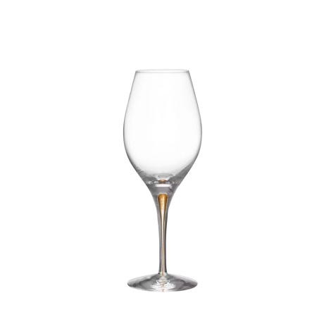 An empty Orrefors Intermezzo Gold Balance wine glass, 14.8oz, with a tall stem and rounded bowl, isolated on a white background.