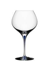A 20oz Orrefors Intermezzo Blue Bouquet Glass with a clear bowl and blue stem, designed by Erika Lagerbielke, is photographed empty against a white background.