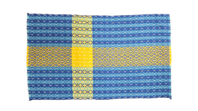 The Center Piece: Swedish Flag 11\x12\ Plus Fringe on Long Ends is a hand woven textile with a blue base, yellow cross pattern inspired by the Swedish flag, intricate geometric designs, and slightly uneven edges.
