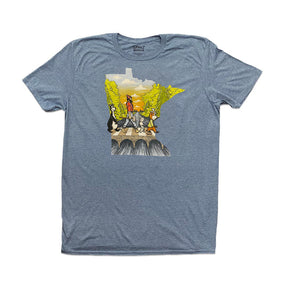 The "Abbey Road with Minnesota Map" tee by Adam Turman is a gray T-shirt showcasing a group of four figures crossing a natural stone bridge surrounded by greenery, artistically shaped like the state of Minnesota. It comes in unisex sizing for a comfortable fit for everyone.