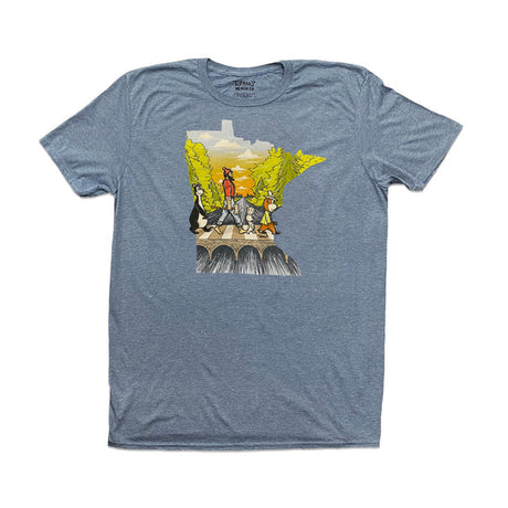 The "Abbey Road with Minnesota Map" tee by Adam Turman is a gray T-shirt showcasing a group of four figures crossing a natural stone bridge surrounded by greenery, artistically shaped like the state of Minnesota. It comes in unisex sizing for a comfortable fit for everyone.