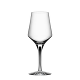 The Orrefors Metropol White Wine Glass with Black Stem, 13.5oz, designed by Erika Lagerbielke, stands centered on a plain white background with its wide bowl and elegant black stem clearly visible.