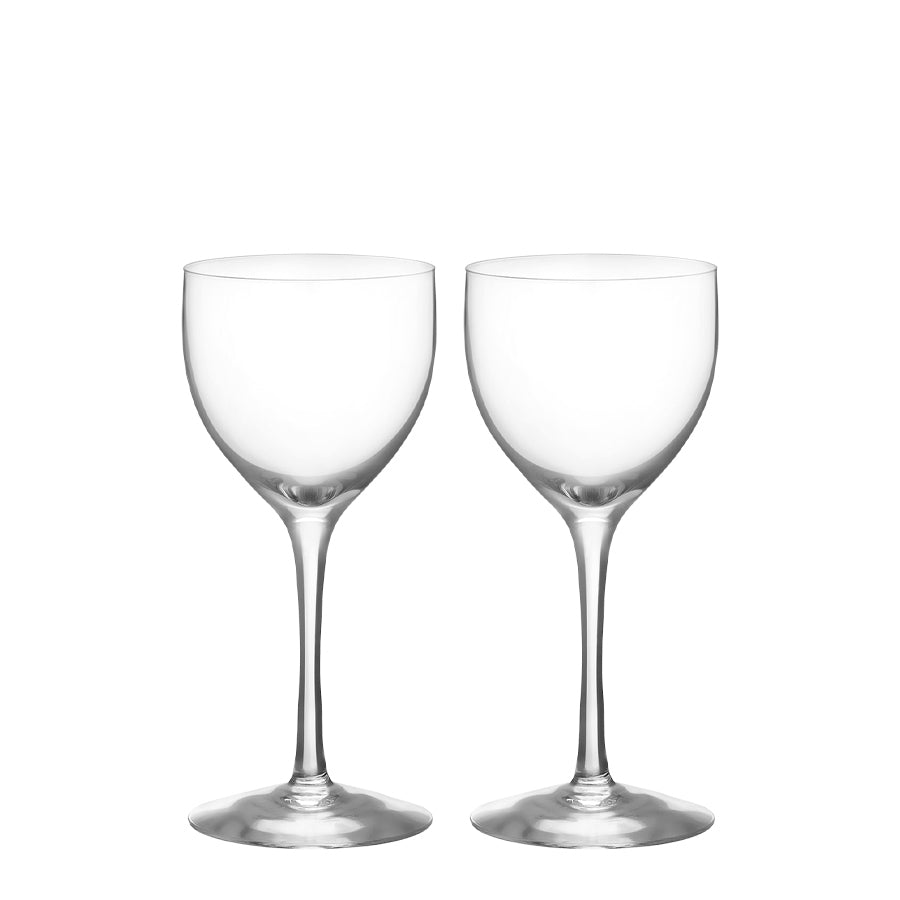 Two empty, clear Orrefors: More Nick & Nora Glasses (5.7oz, 2-Pack) with long stems stand side by side against a plain background.