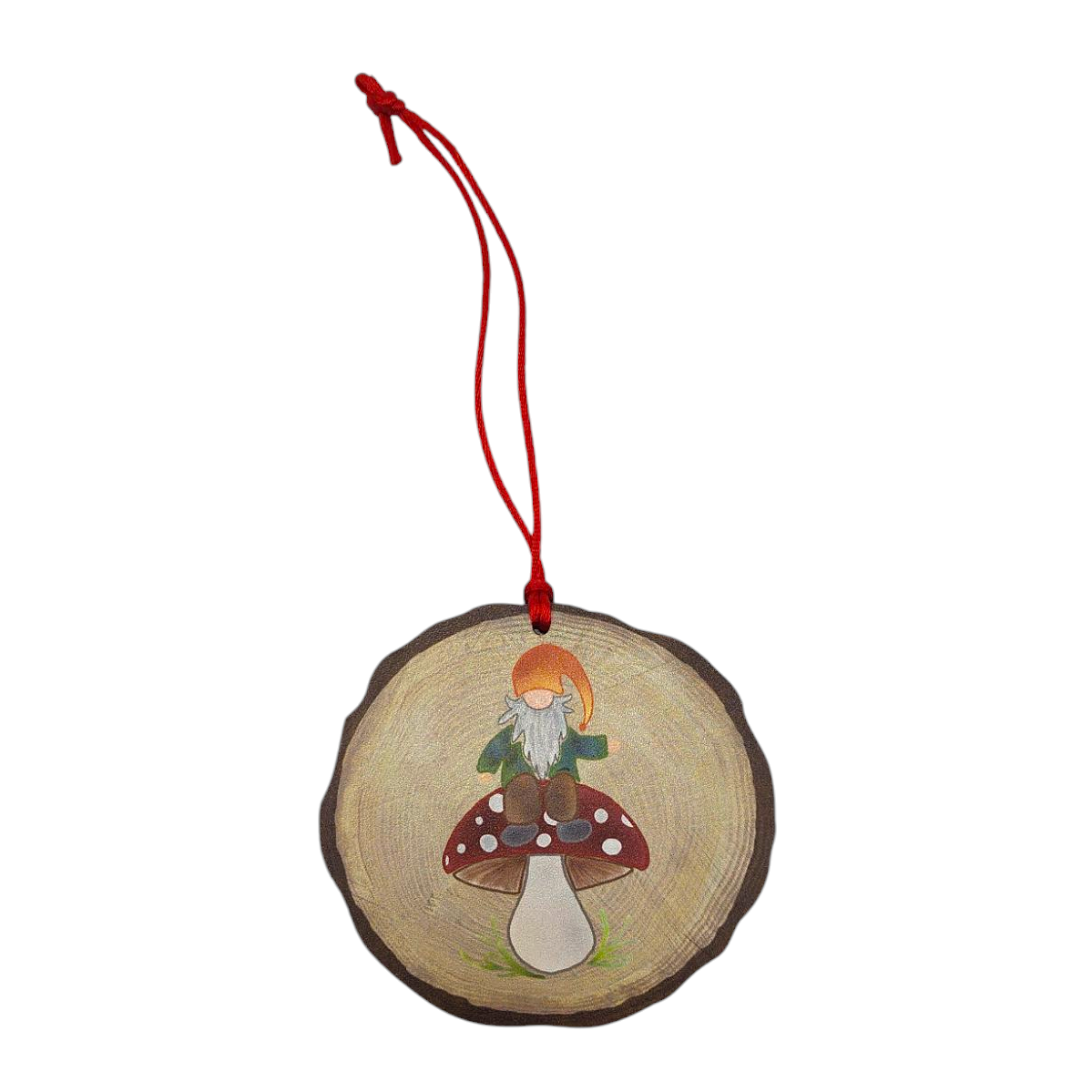 This charming wooden ornament, part of the Nordic Collection, features a nisse on a red-capped mushroom and includes a festive red hanging string.