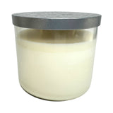 The Candle: Nordic Balsam - Winter Forest Candle features a clear glass jar with white soy blend wax and a metallic lid, making it the perfect festive Christmas candle.