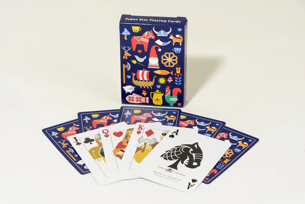 The Bundle: Nordic Love PuzzleTwist, Mug and Deck of Cards features Cindy Lindgren's Scandinavian-themed illustrations on the card deck, celebrating heritage with unique designs on the box and cards.